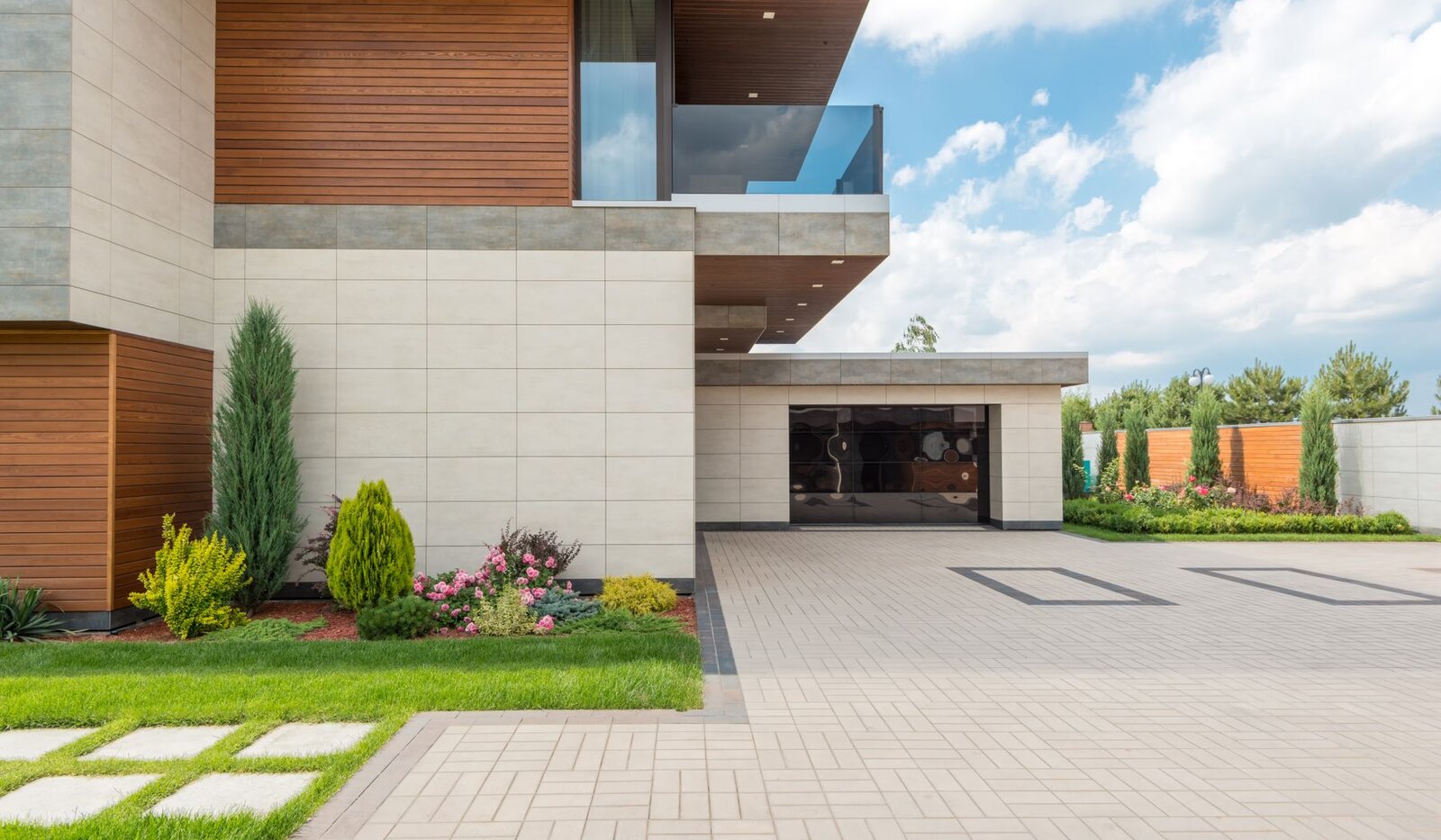 A contemporary home with a landscaped garden and spacious driveway